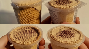 Elegantes carlotas de café servidas en copas de vidrio con galletas canelitas trituradas, decoradas con crema batida y granos de café sobre mesa de madera
