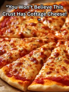 Close-up of cheesy homemade pizza slices with golden-brown crust and melted mozzarella.