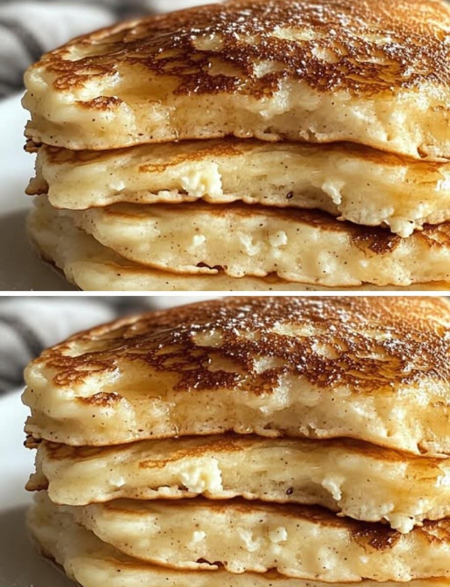 Pila de hotcakes esponjosos de cottage y almendra con toque de canela, cubiertos con miel.